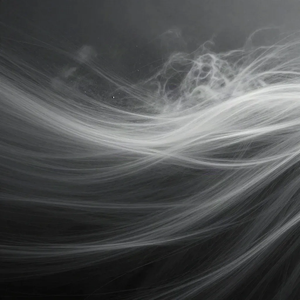 Silver filaments stream into a soft white bloom over graphite haze with empty copy space.